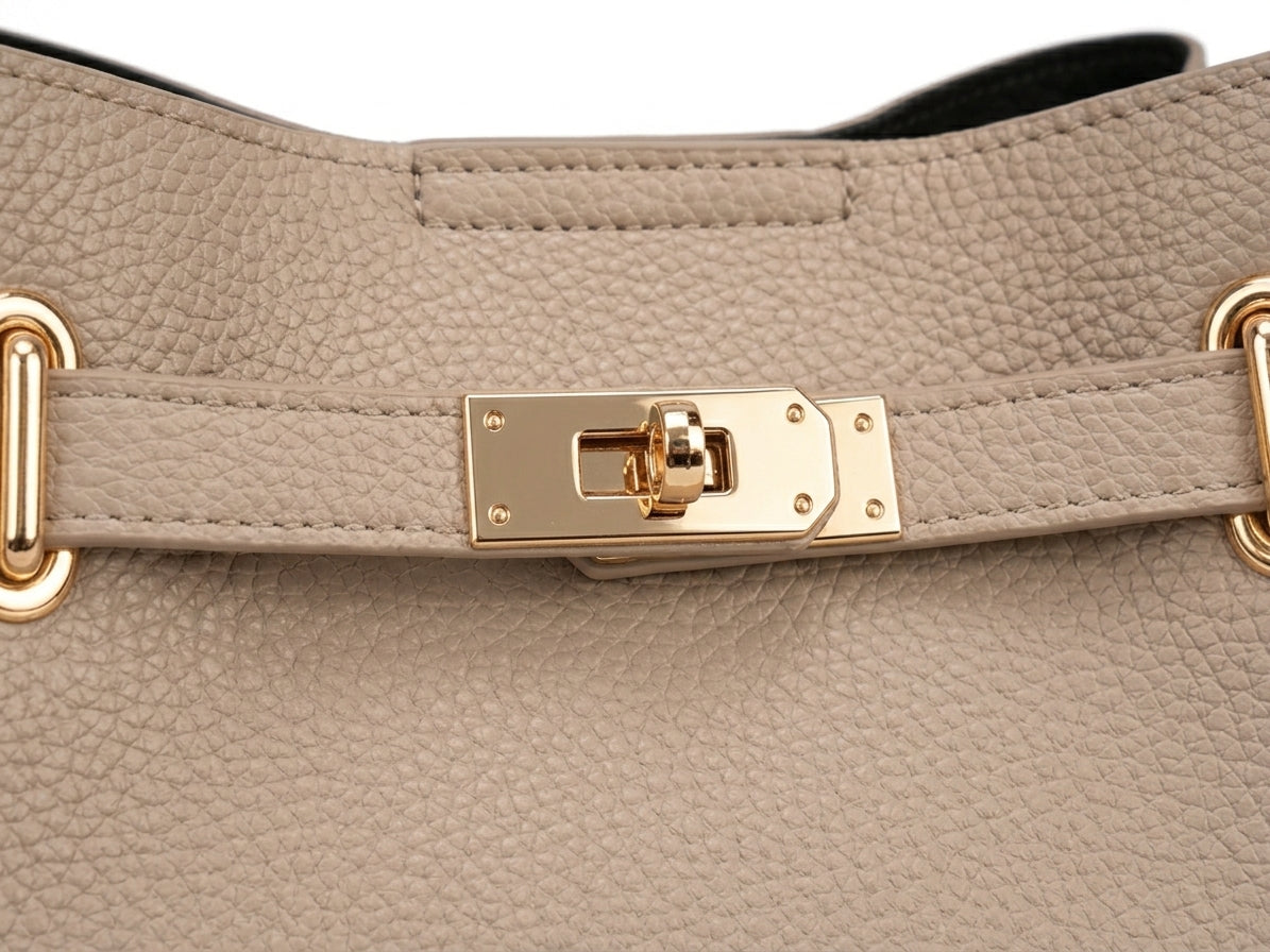 Close-up of gold turn-lock closure hardware detail