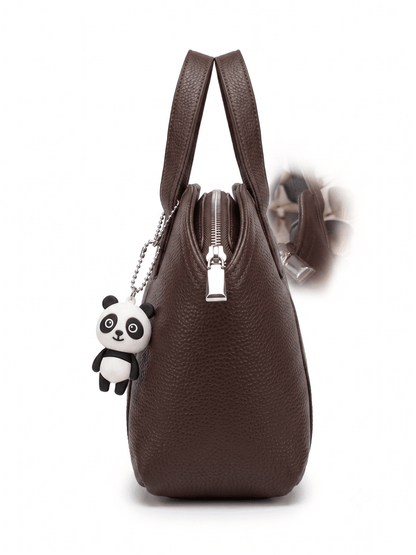 Brown pebbled leather mini satchel side view showing zipper and panda charm