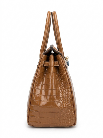 Tan crocodile-embossed leather tote bag side view showing structured silhouette