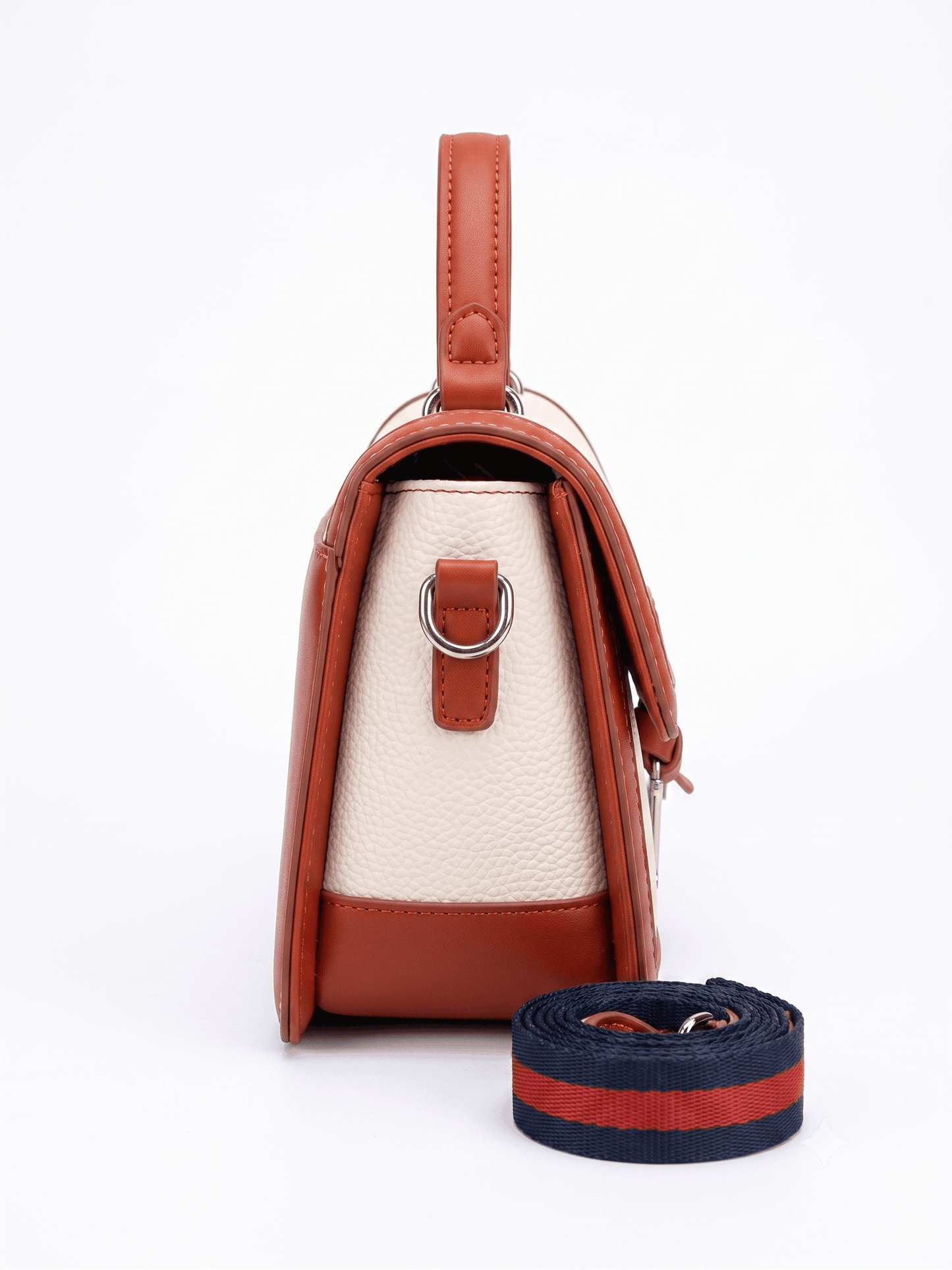 Cream canvas and tan leather trim satchel bag front view with silver D-charm