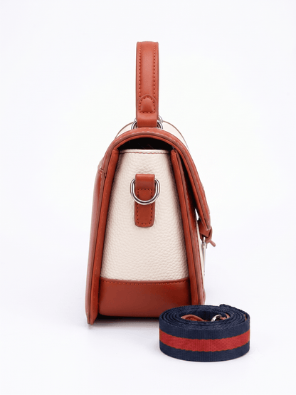 Cream canvas and tan leather trim satchel bag front view with silver D-charm