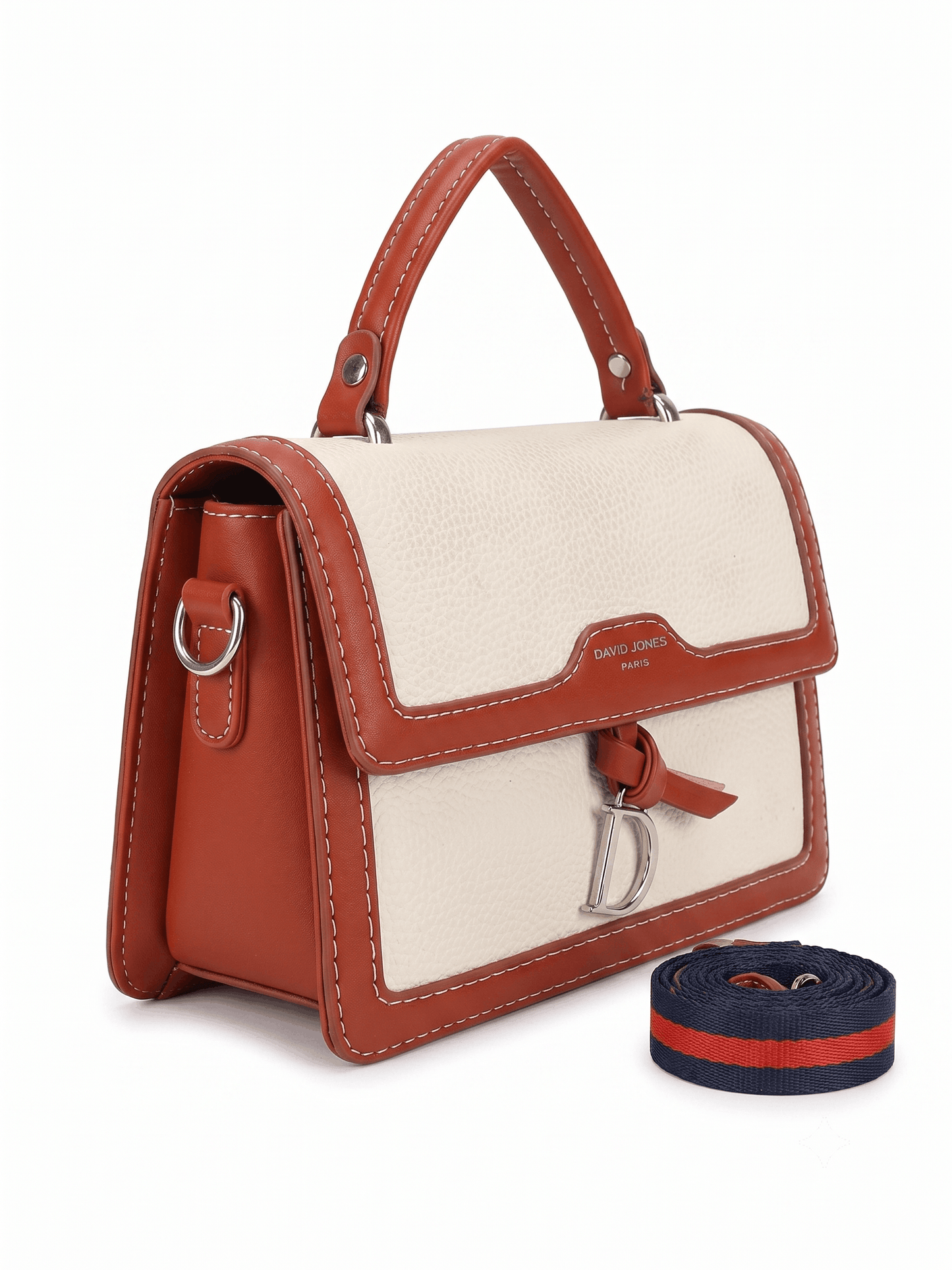 Cream canvas satchel bag side view showing tan leather trim and silver hardware