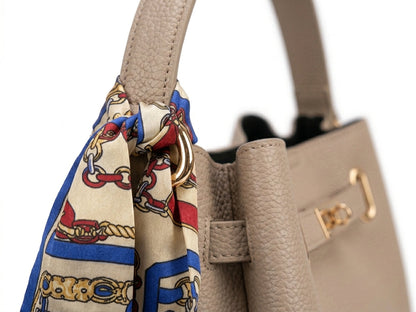 Taupe leather bucket bag front view with gold turn-lock hardware